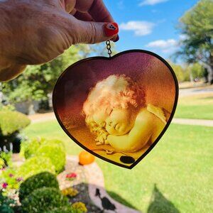Vintage Enesco glass sun catcher of cupid sleeping
